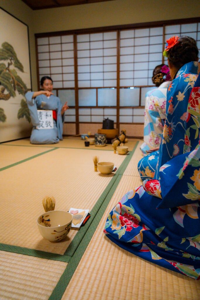 A traditional matcha tea ceremony with tatami and kimono at Maikoya teahouse in Kyoto, Japan.