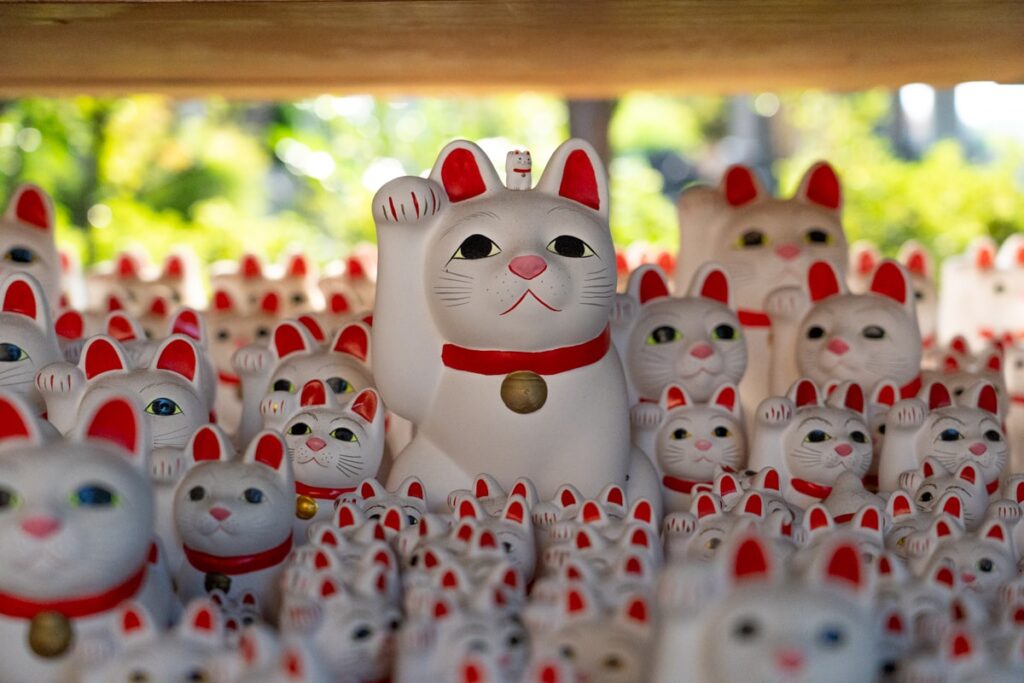 Rows of maneki-neko lucky cat statues at Gotokuji Temple in Tokyo.